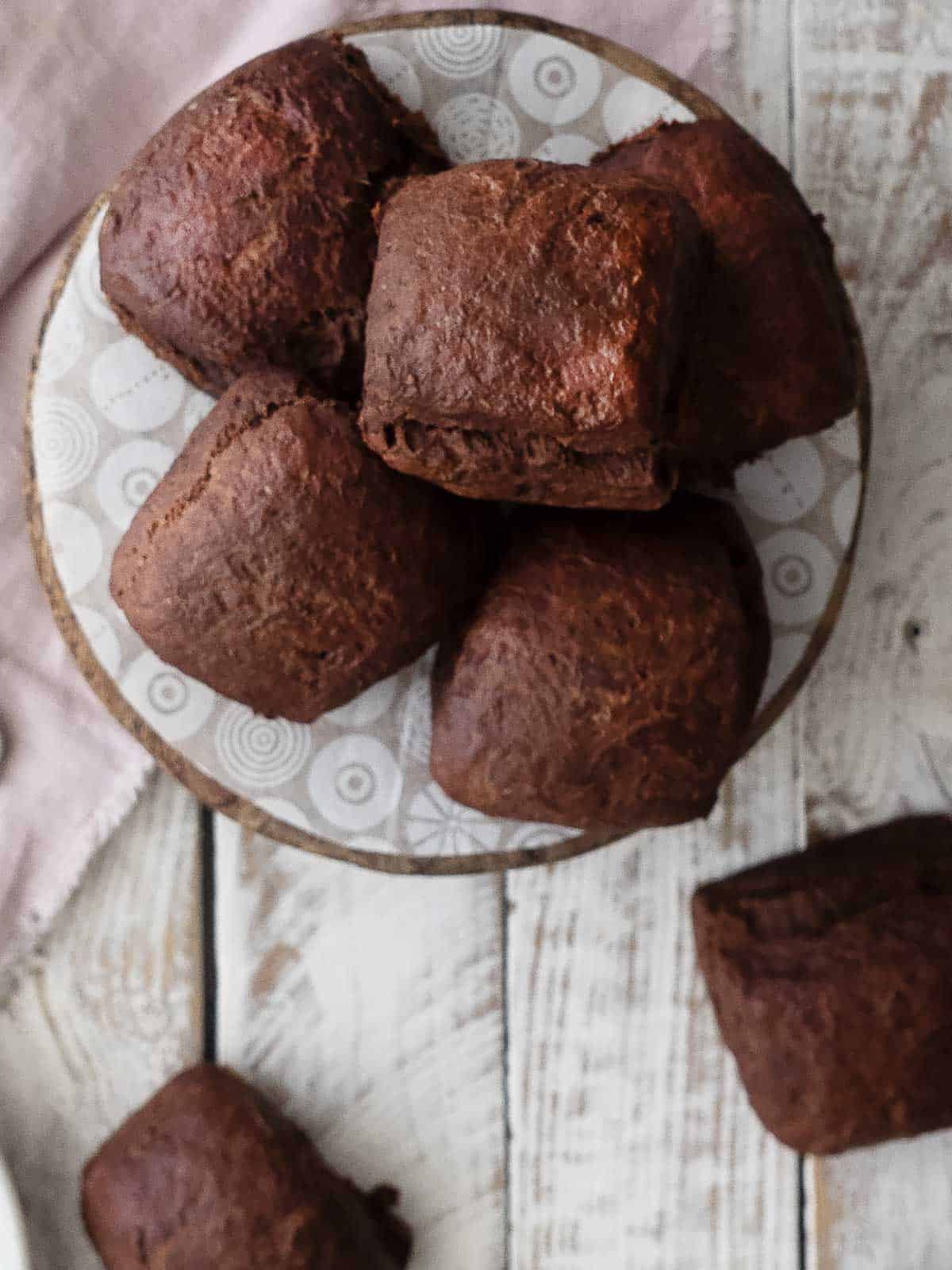 Chocolate scones on a serving plate.