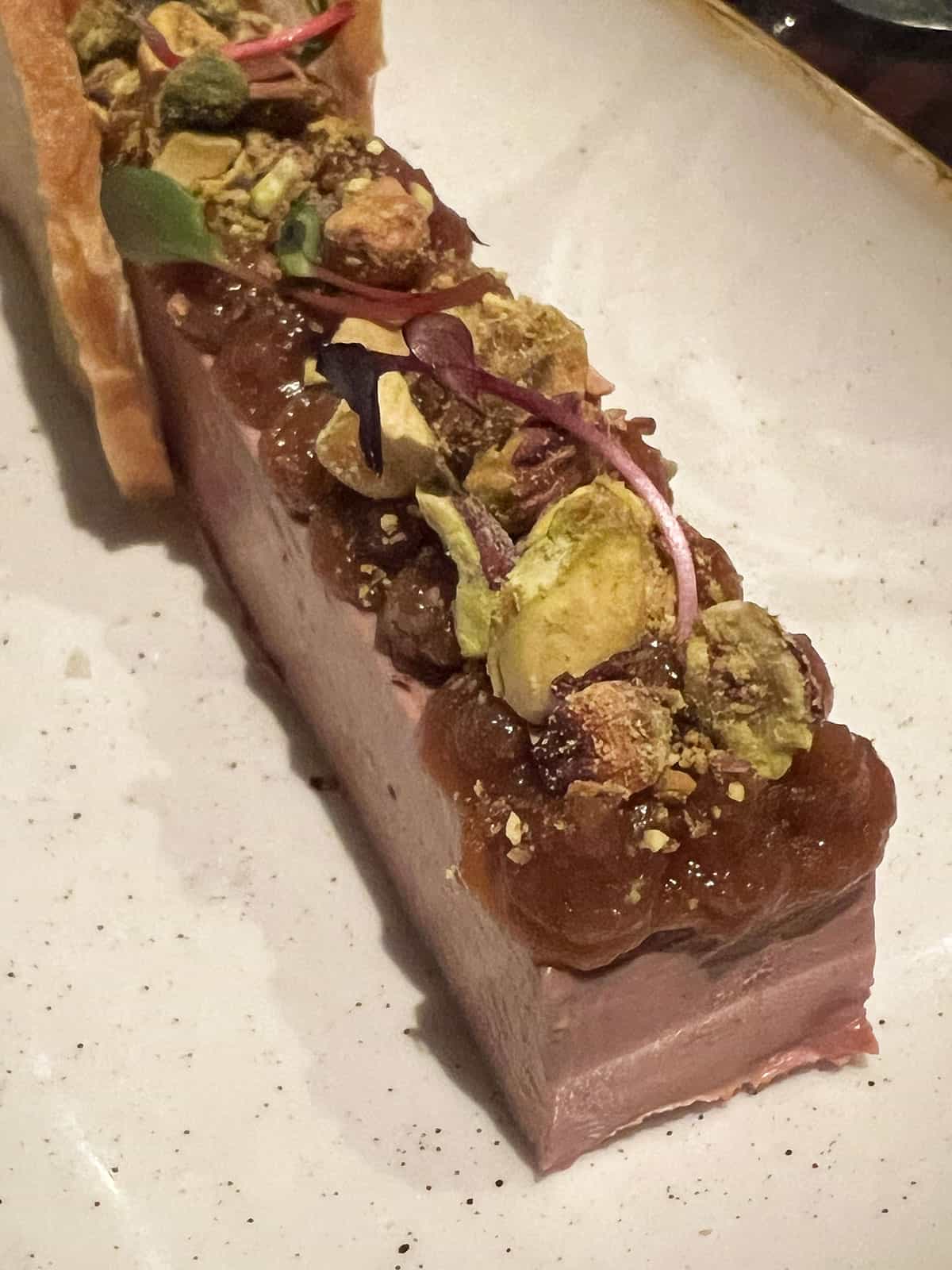 Chicken liver parfait on a serving plate.