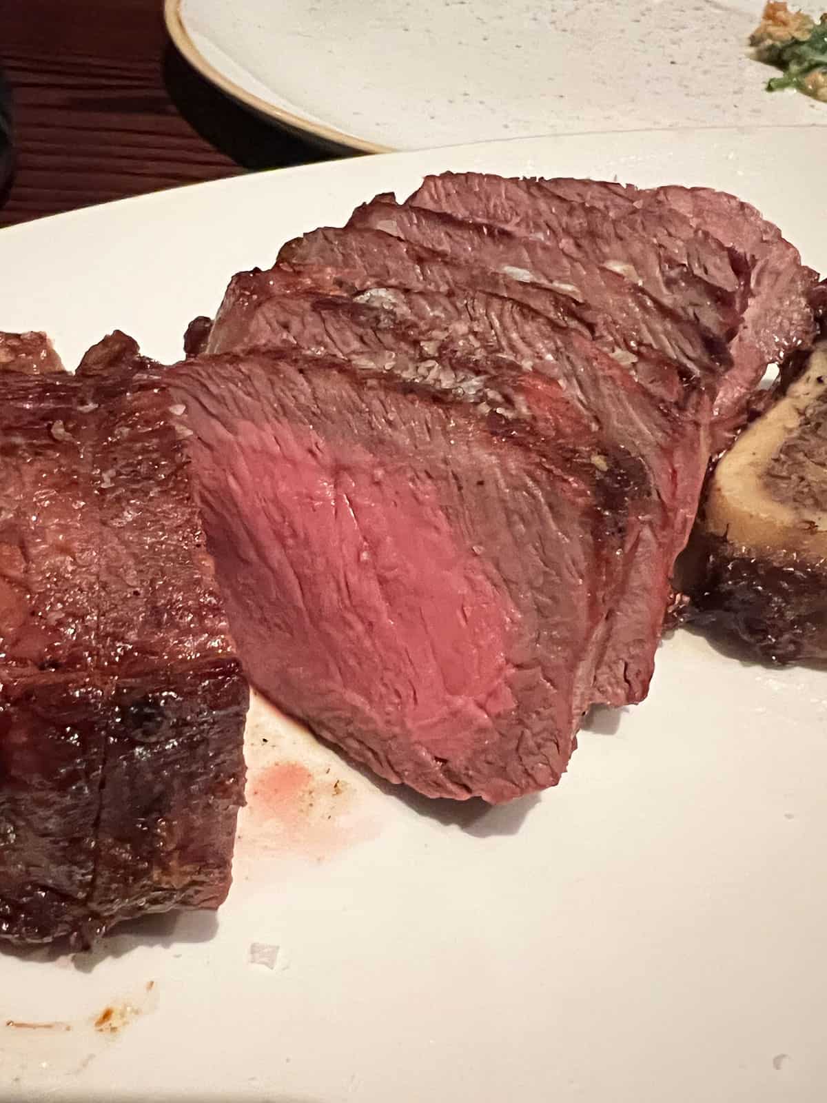 Sliced sirloin cooked medium rare.