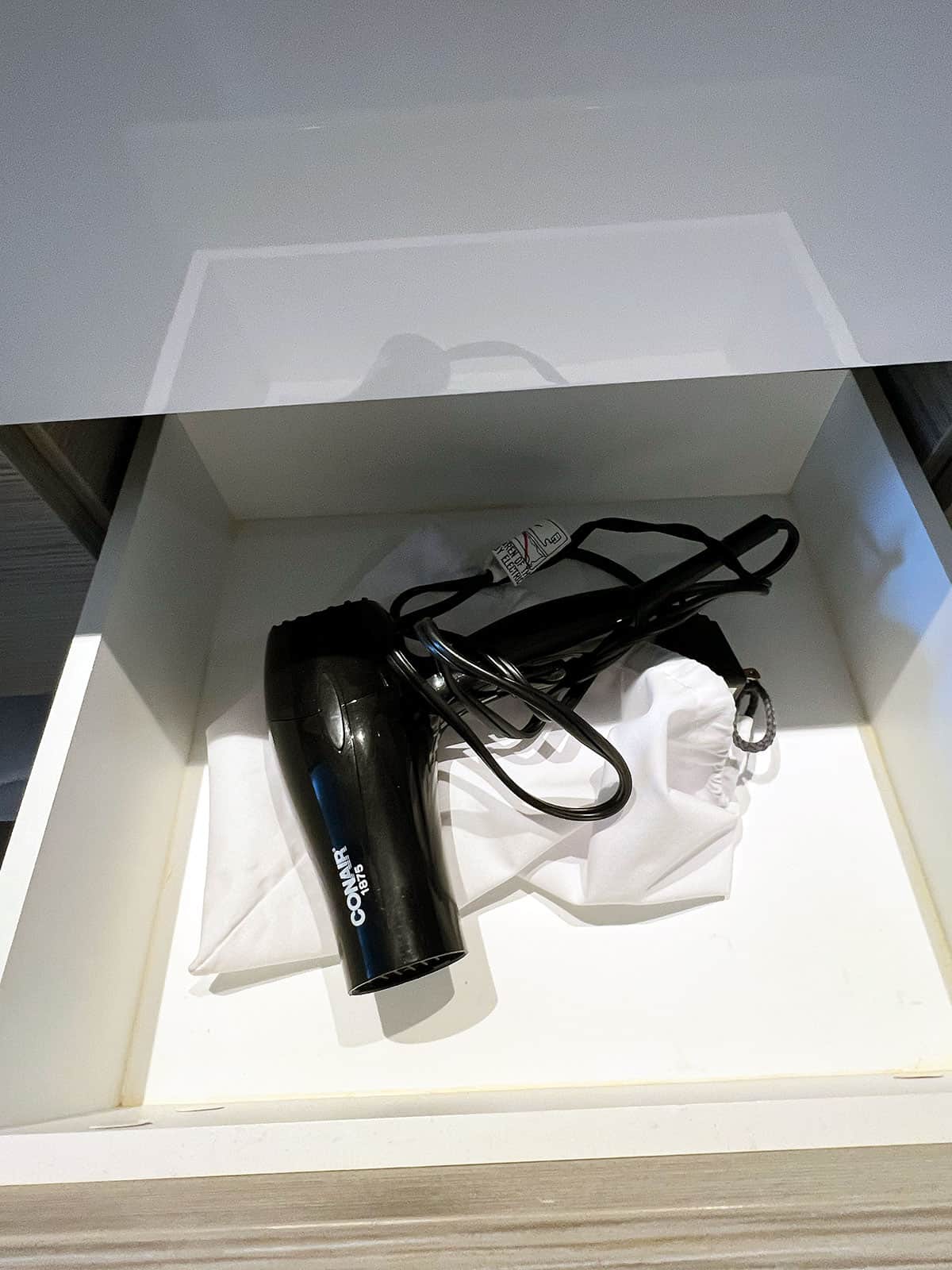 Hair dryer in a drawer.