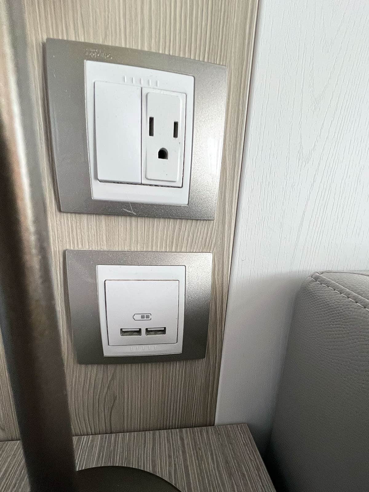 Charging facilities on the wall above the bed side table.