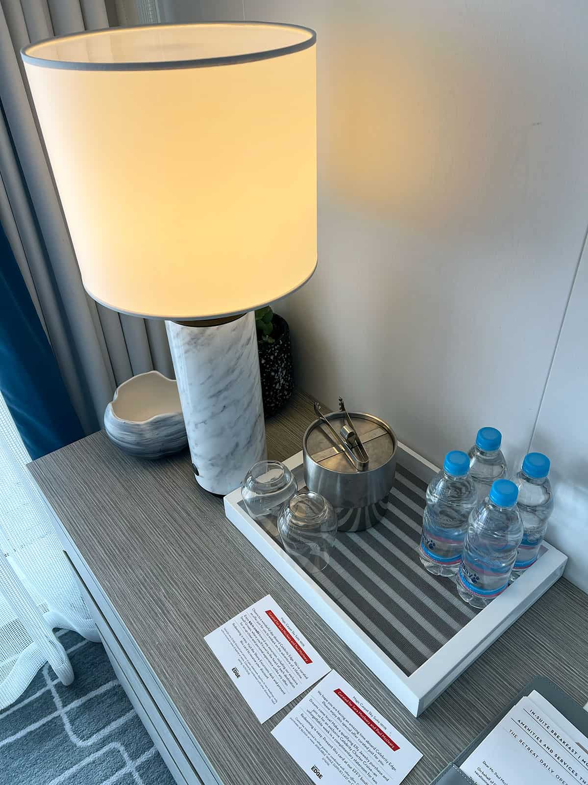 Bottles of water and an ice bucket.
