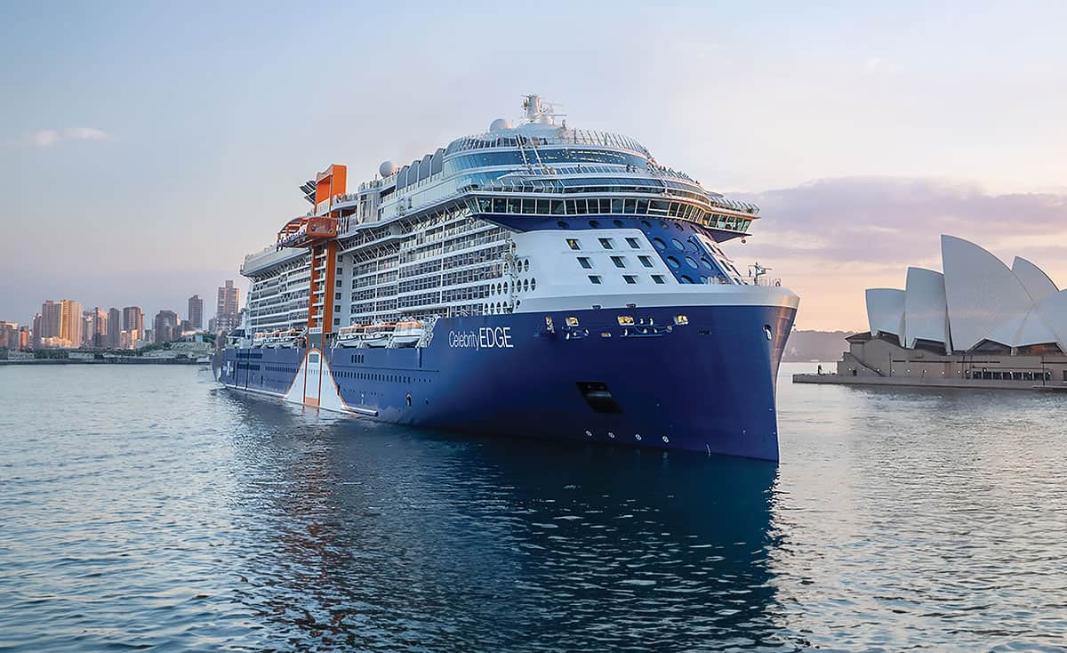 Celebrity Edge cruise ship on Sydney Harbour with the Opera House in the background.