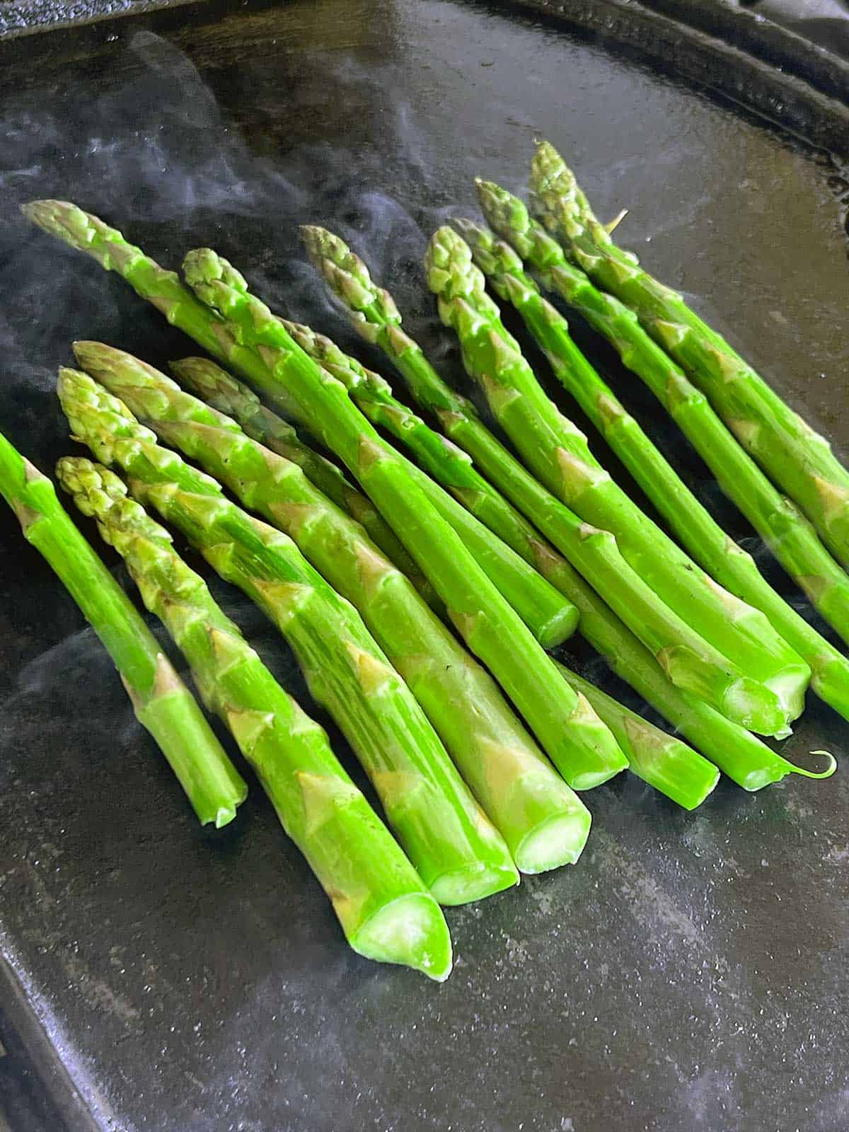 Asparagus on a bbq hot plate.